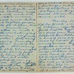 Open book, 2 cream pages with faint grid pattern. Cursive handwritten text in blue ink. Page 38 and 39.