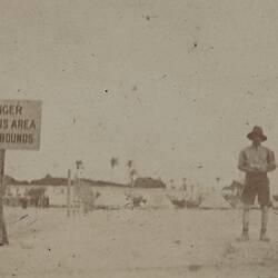 Photograph - Man Standing Near Sign Warning of Tetanus Area, Egypt, World War I, 1914-1918