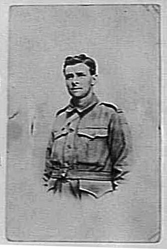 Studio portrait of man in military uniform.