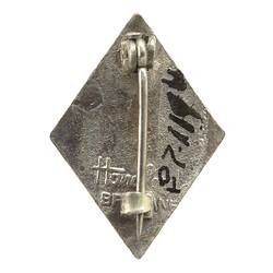 Back of diamond-shaped metal lapel pin.