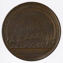 Round medal showing naval battle at sea.