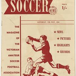 Magazine, front cover, red printed image of soccer players and text.