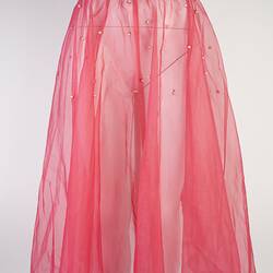 Pink chiffon mid-calf skirt. Pearl waistband, some dotted below. Silver hem.