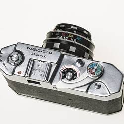 All-metal chrome and black body 35mm camera. Top view.