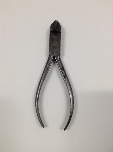 Metal pliers with tapering handles.