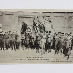 Front of postcard showing group of men on steps with flags.