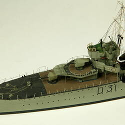 Grey coloured naval ship, detail of front of deck.