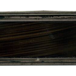 Rectangular whale baleen and silver snuff box. Profile with lid closed.