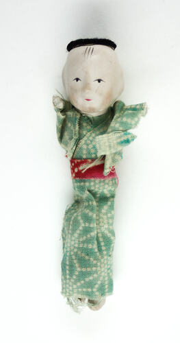 Small Japanese doll in kimono, front side.