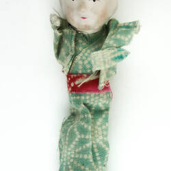 Small Japanese doll in kimono, front side.