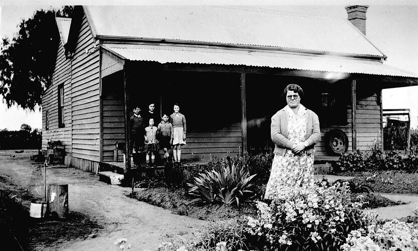 [Violet Dohnt in her front garden, Nathalia, near Shepparton, about 1940.]