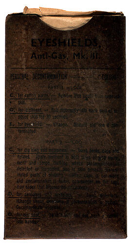 Front of cardboard packet with printed writing.