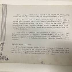 White page with dark blue text. Sketch of snake at lower left.