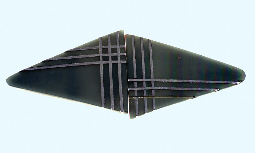 Triangular belt buckle in green plastic.