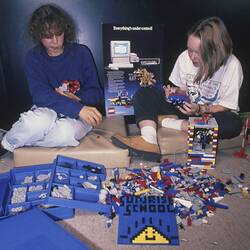 Digital Photograph - Odetta Moore & Caitlin O'Connell Demonstrating LEGO, Sunrise School, Melbourne Museum, Russell Street, 1989