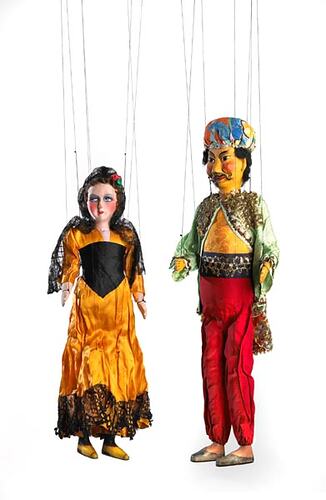 Front view of two puppets in bright clothing.