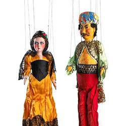 Front view of two puppets in bright clothing.