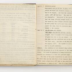Open book with off white pages. Typed text on right side.