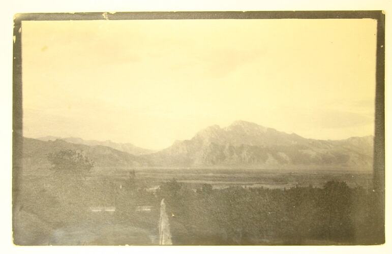 View across plains towards a mountain range.