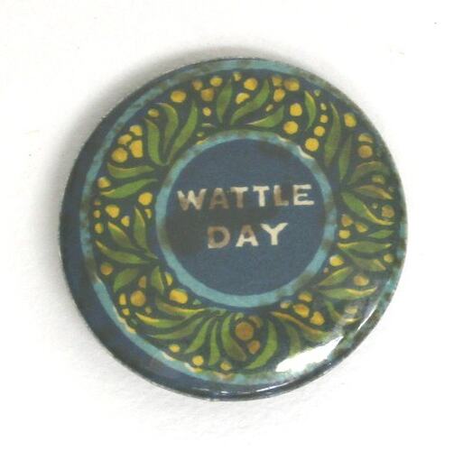 Badge with blue background, circular green and yellow floral motif and white text.