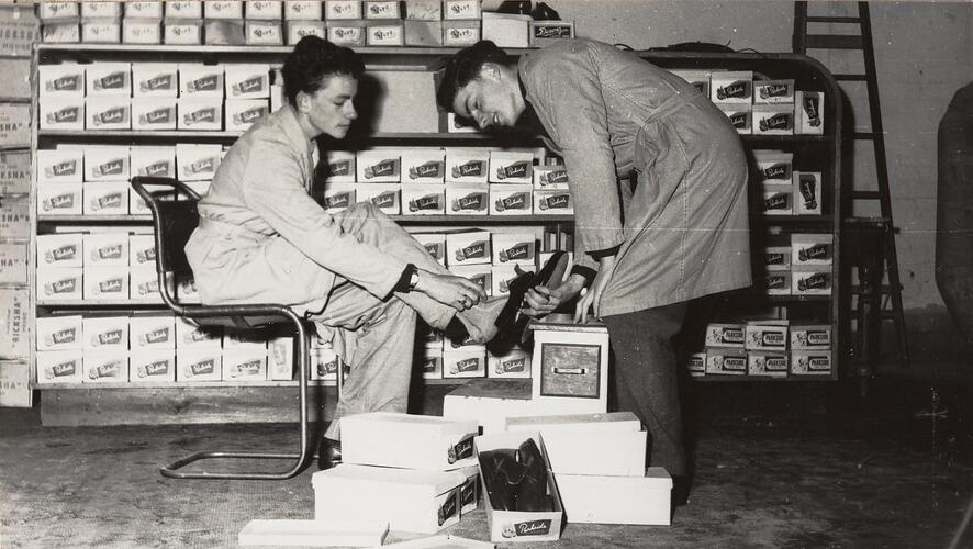 Digital Photograph - Boys trying on Shoes at Remainder Auction House, Shepparton, 1955