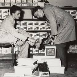 Digital Photograph - Boys Trying on Shoes at Remainder Auction House, Shepparton, 1955