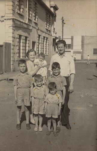 Digital Photograph - Mother, Father, Baby & Four Sons, near State Bank, Fitzroy, 1957