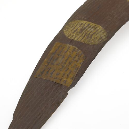 Detail of painted wooden boomerang.