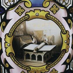 Stained glass window showing a printing scene.