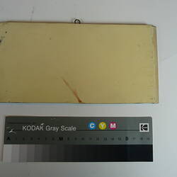 Painted board showing sample of cream colour.