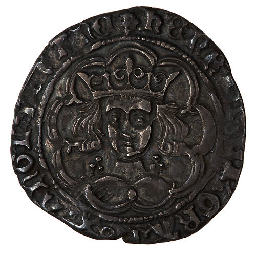 Coin, round, crowned bust of the King facing (leaf on breast) within a tressure of nine arches.