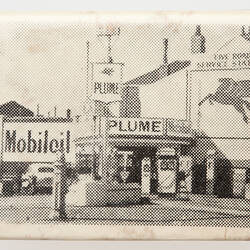 White matchbox cover with black printed image of service station.