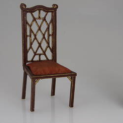 Fretwork chair in maroon with gold detail
