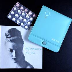 Blue information kit and pill pack.