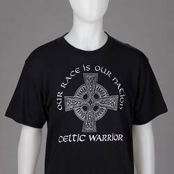 Black t-shirt, celtic cross logo surrounded by writing.