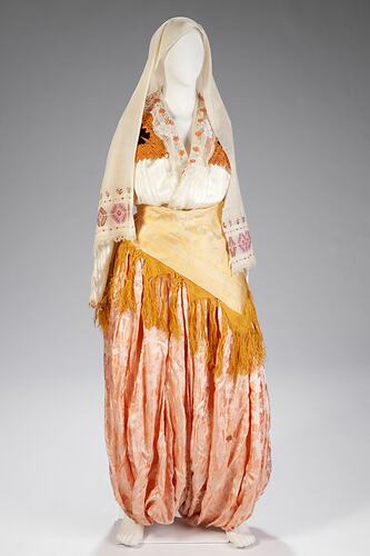 Silk orange, pale pink female wedding outfit: shirt, harem-style pants, waistcoat and scarf, headscarf.