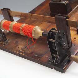 Detail of unplying machine, used in weaving.