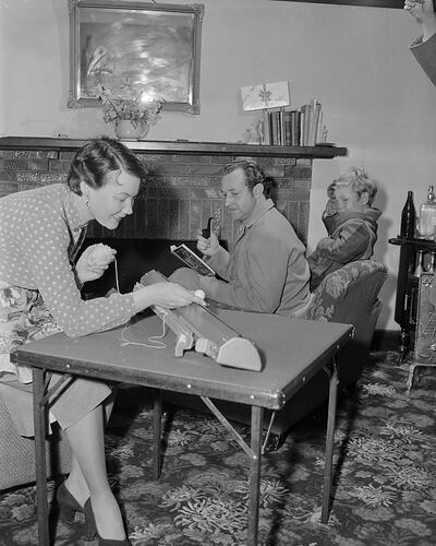 Woman Using a Knitting Machine in a Domestic Setting, Melbourne, Victoria, 1953
