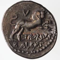 Round coin, aged, bull charging to right, writing underneath.