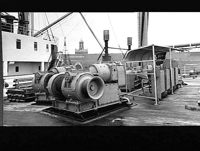 Ship deck with forecastle deck winches and controls.