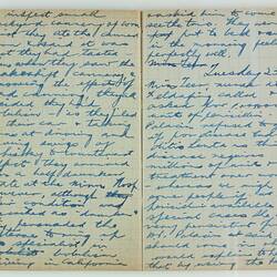 Open book, 2 cream pages with faint grid pattern. Cursive handwritten text in blue ink. Page 40 and 41.