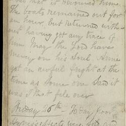 Open diary with handwritten text on discoloured worn page.