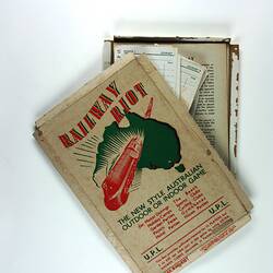 Game box with contents just visible, with train on cover