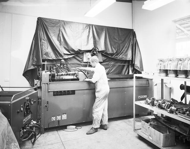 Monochrome image of aircraft mechanics.