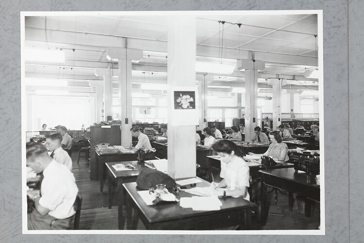 Monochrome photograph of an office interior.