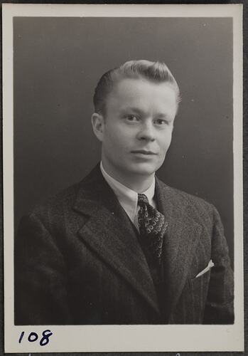 Studio portrait of man in a suit.