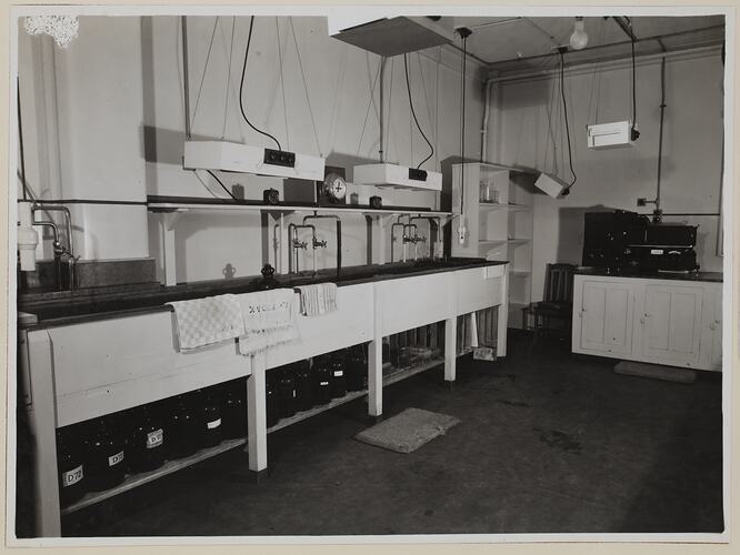 Bench with sinks and chemistry equipment.