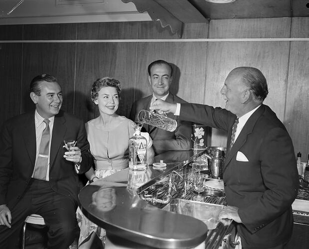A & G Gilbey Ltd, Man Serving Gilbey's Gin at a Bar, Moorabbin, Victoria, Jan 1959