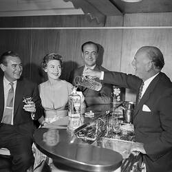 Negative - A & G Gilbey Ltd, Man Serving Gilbey's Gin at a Bar, Moorabbin, Victoria, Jan 1959