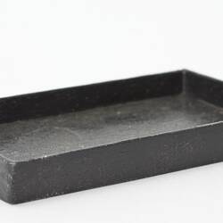 Miniature oven tray from a doll's house.